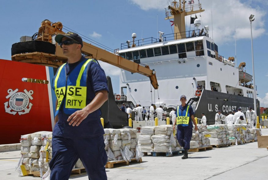 Crew members from the U.S. Coast Guard Cutter Oak unload 15,000 pounds (6,804 kg) of cocaine worth more than $180 million at Base Support Unit Miami August 2, 2011. The haul was recovered from a self propelled submersible vessel in the western Caribbean