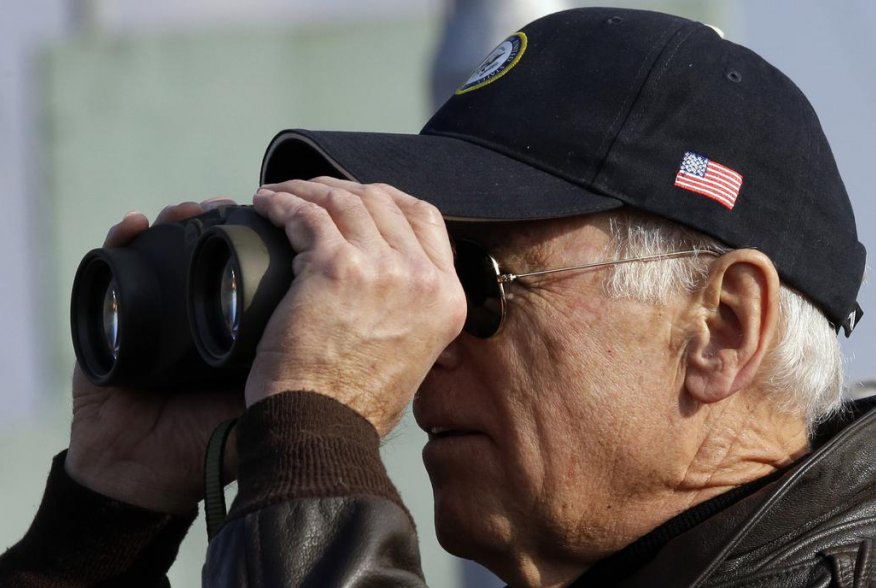 U.S. Vice President Joe Biden looks through binoculars to see North Korea from Observation Post Ouellette during a tour of the Demilitarized Zone (DMZ), the military border separating the two Koreas, in Panmunjom, December 7, 2013. REUTERS/Lee Jin-man/Poo