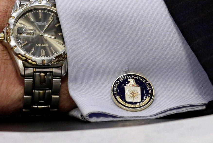 An cufflink with CIA logo is seen on CIA Director John Brennan's shirt as he testifies before the Senate Intelligence Committee hearing on "diverse mission requirements in support of our National Security", in Washington, U.S., June 16, 2016. REUTERS/Yuri