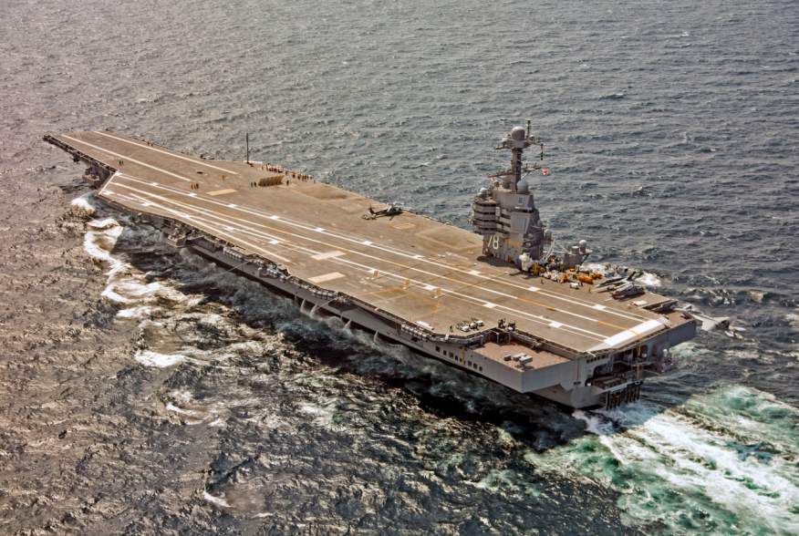 A U.S. Navy F/A-18F Super Hornet approaches the USS Gerald R. Ford to use the new AAG arrested landing system in the Atlantic Ocean July 28, 2017. The carrier was also testing the EMALS electromagnetic launch system