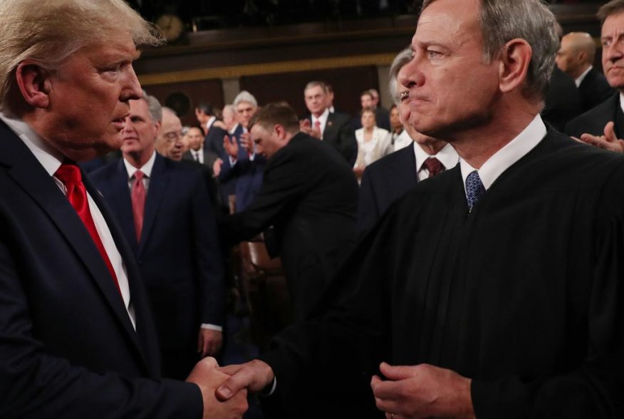 U.S. President Donald Trump greets Supreme Court Chief Justice John Roberts as he arrives to deliver his State of the Union address to a joint session of the U.S. Congress in the House Chamber of the U.S. Capitol in Washington, U.S. February 4, 2020. REUT