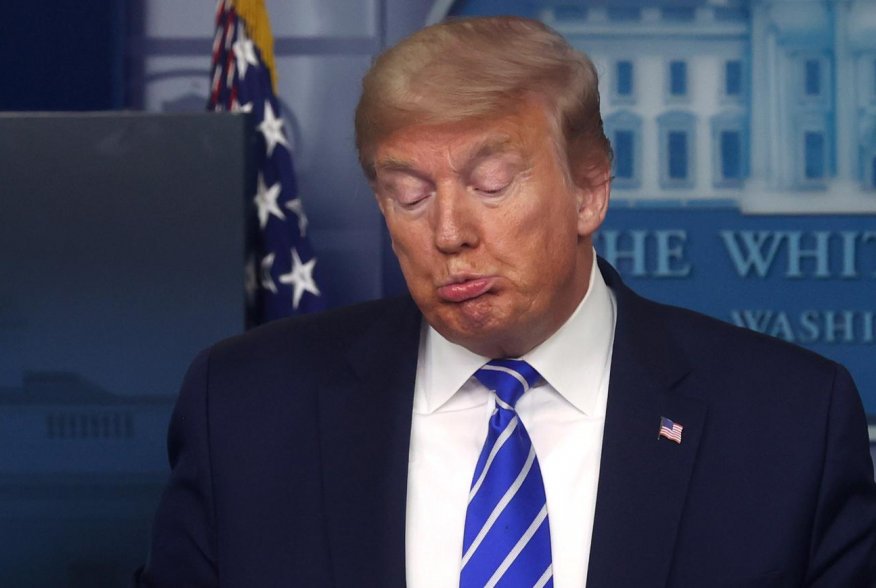 U.S. President Donald Trump reacts as he leads the daily coronavirus disease (COVID-19) outbreak task force briefing at the White House in Washington, U.S. April 23, 2020. REUTERS/Jonathan Ernst