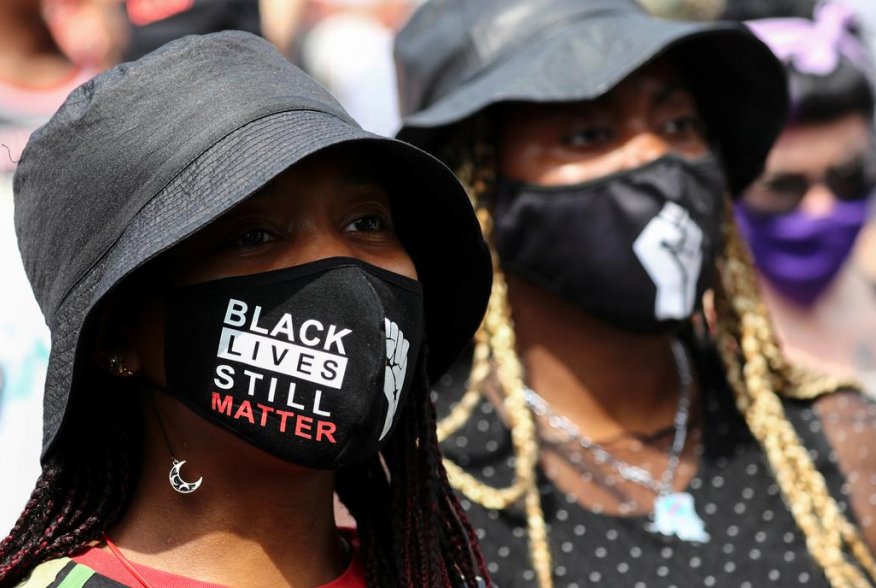 Demonstrators take part in a Black Lives Matter protest outside Tottenham police station in London, Britain August 8, 2020. REUTERS/Simon Dawson