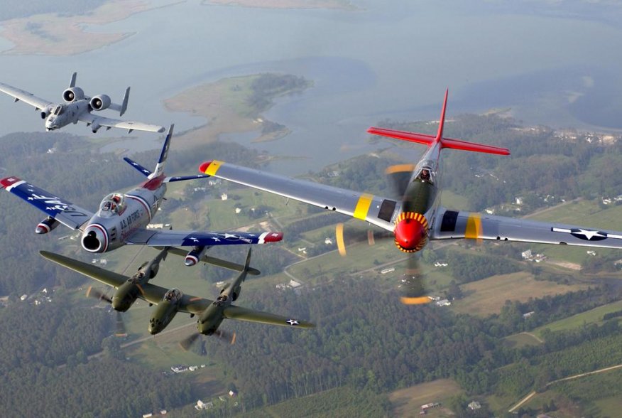 An A-10 Thunderbolt II, F-86 Sabre, P-38 Lightning and P-51 Mustang fly in a heritage flight formation during an air show at Langley Air Force Base, Va., on May 21. U.S. Air Force/Tech. Sgt. Ben Bloker.