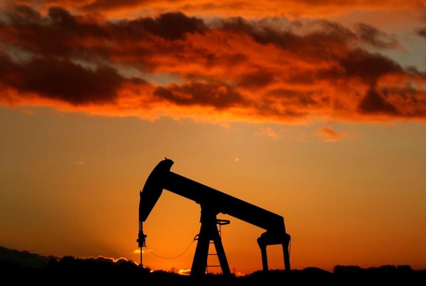 A oil pump is seen at sunset outside Scheibenhard, near Strasbourg, France, October 6, 2017 . REUTERS/Christian Hartmann