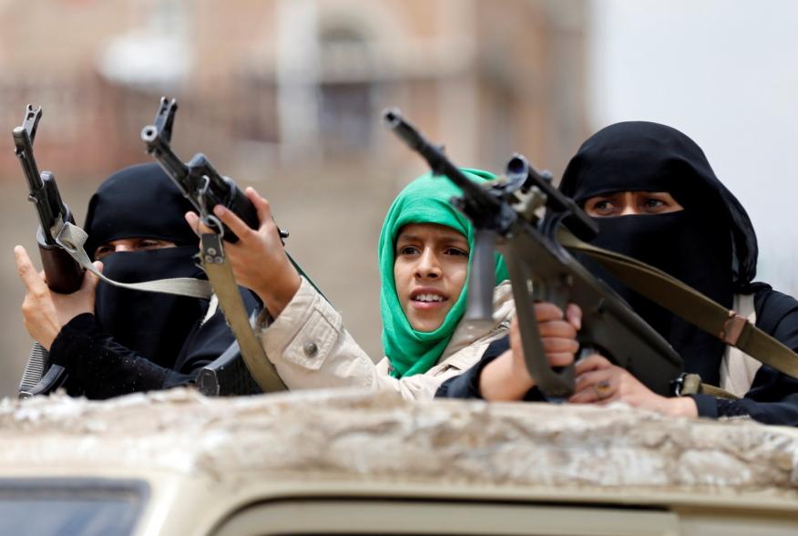 Armed women loyal to the Houthi movement ride on the back of a truck as they take part in a parade to show support for the movement in Sanaa, Yemen September 6, 2016. REUTERS/Khaled Abdullah