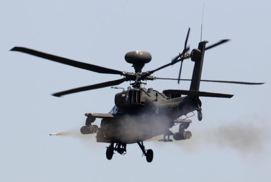 A U.S. AH-64 Apache helicopter fires a missile during a live fire gunnery exercise with the South Korean army at the U.S. army's Rodriguez range in Pocheon