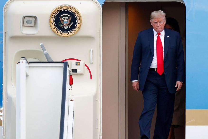 U.S. President Donald Trump and first lady Melania Trump arrive aboard Air Force One ahead of the NATO Summit, at Brussels Military Airport in Melsbroek, Belgium July 10, 2018. REUTERS/Francois Lenoir TPX IMAGES OF THE DAY