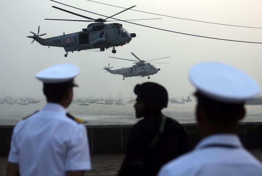 Indian Navy soldiers watch Sea King Mk 42 ASW helicopters during the rehearsal ahead of Navy Day celebrations in Mumbai, India, December 3, 2018. REUTERS/Francis Mascarenhas