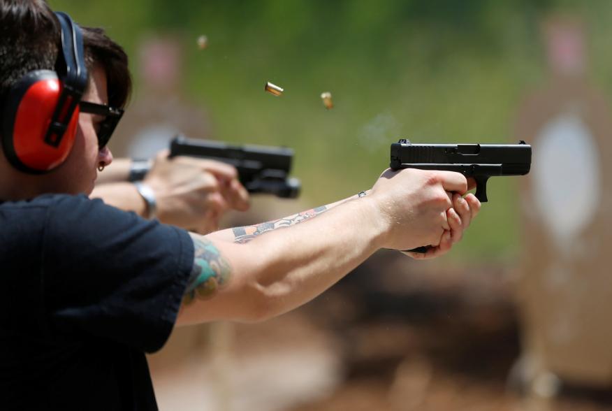 Skylar Simon shoots at targets during a firearms training class attended by members of the Pink Pistols, a national pro-gun LGBT organization, at the PMAA Gun Range in Salt Lake City, Utah, U.S., July 1, 2016. REUTERS/Jim Urquhart/File Photo