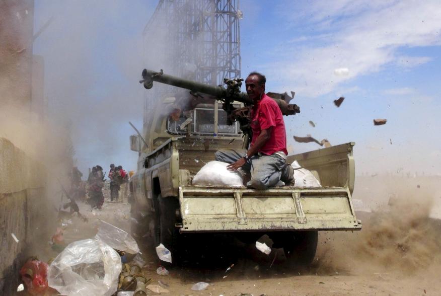 A Southern Popular Resistance fighter fires a weapon mounted on a truck during clashes with Houthi fighters in Yemen's southern city of Aden May 3, 2015. Between 40-50 Arab special forces soldiers arrived in Aden on Sunday and deployed alongside local fig