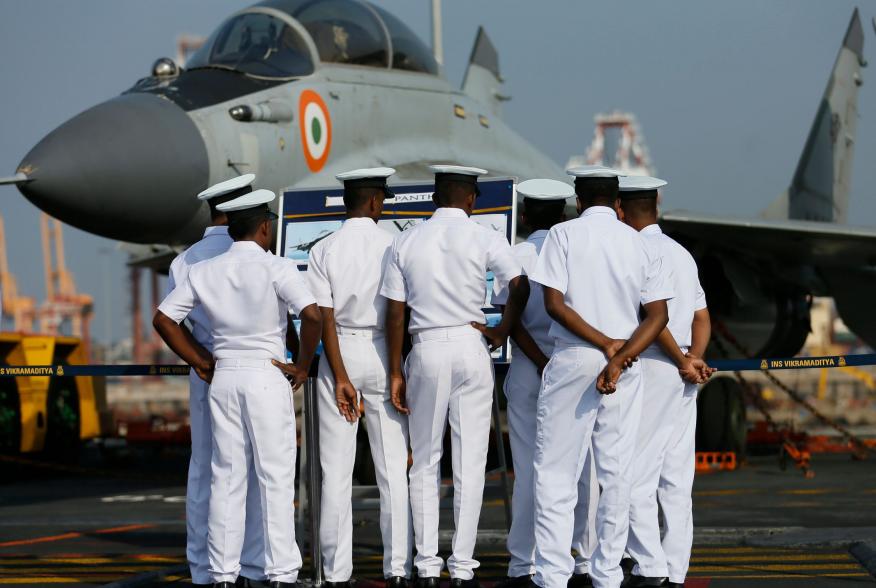 Members of the Sri Lankan navy inspect the Indian Mig fighter jets on Indian Navy's largest aircraft carrier INS Vikramaditya at Colombo port in Sri Lanka January 21, 2016. REUTERS/Dinuka Liyanawatte