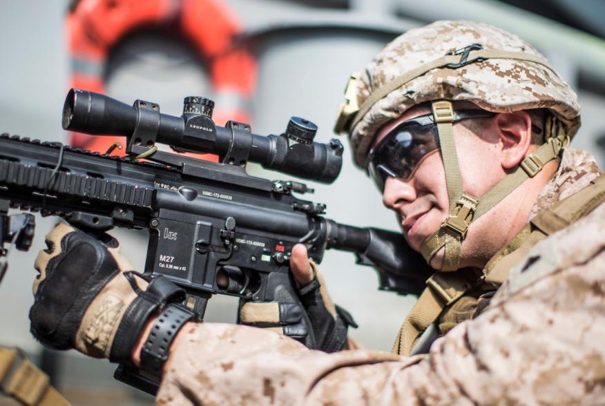 A U.S. Marine Corps rifleman with Kilo Company, Battalion Landing Team 3/5, provides security with an M27 Infantry Automatic Rifle on aboard the amphibious assault ship USS Boxer (LHD 4) during its transit through Strait of Hormuz in Gulf of Oman