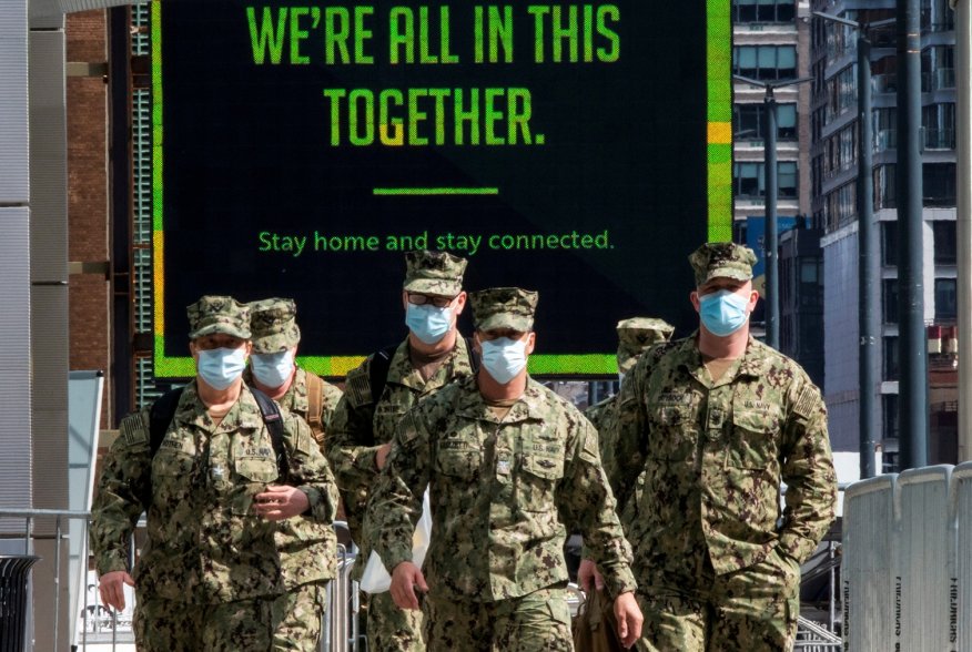 U.S. military personnel wearing face masks arrive at the Jacob K. Javits Convention Center, as the outbreak of the coronavirus disease (COVID-19) continues, in the Manhattan borough of New York City, New York, U.S., April 7, 2020. REUTERS/Eduardo Munoz TP