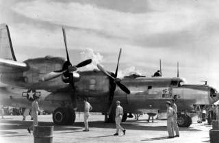 AAF personnel at Clark Field, Philippines, get their first look at a Consolidated B-32 Dominator in May 1945. Comparable to the B-29 in size and performance, B-32s saw service with only one bomber squadron before war's end. (U.S. Air Force photo)