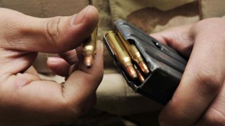 A student loads a magazine during the live-firing portion of a Combat Arms Training and Maintenance class on base Jan 21. The M-16A2 fires 5.56 mm semi-jacketed frangible rounds and each magazine holds up to 30 rounds. (U.S. Air Force photo by Airman 1st 