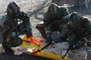 Marines from Marine Forces Reserve rescue and extract a victim from a contaminated area during a chemical, biological, radiological and nuclear defense training simulation aboard Naval Air Station Joint Reserve Base New Orleans, Feb. 5, 2015.