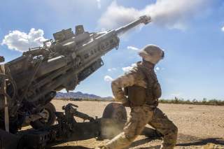 Marine Corps Cpl. Eduardo Osorionunez fires an M777 howitzer during a battle drill at Fire Base Burt, Calif., Oct. 1, 2016.