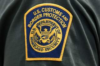 FILE PHOTO: A U.S. Customs and Border Protection patch is seen on the arm of a U.S. Border Patrol agent in Mission, Texas, U.S., July 1, 2019. REUTERS/Loren Elliott/File Photo