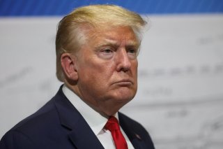 U.S. President Donald Trump pauses in front of a diagram while touring the Ford Rawsonville Components Plant, which is making ventilators and medical supplies, during the coronavirus disease (COVID-19) pandemic in Ypsilanti, Michigan, U.S., May 21, 2020. 