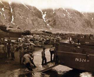 Aleutian Islands Campaign, June 1942 - August 1943. Unloading supplies on invasion beachhead, Attu, on the day of the attack, May 14, 1943. U.S. Navy 