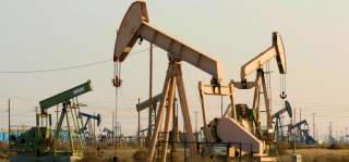 Hundreds of Chevron oil pump jacks nod up and down drawing oil from the Lost Hills Oil Field in the San Joaquin Valley in Central California.