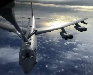 A U.S. Air Force KC-135 Stratotanker, assigned to the 506th Expeditionary Air Refueling Squadron, refuels a B-52 Stratofortress over the Indian Ocean June 10, 2018. (U.S. Air Force photo by Airman 1st Class Gerald R. Willis). Flickr / U.S. Department of D