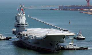 China's first domestically developed aircraft carrier is seen at a port in Dalian after completing its first sea trials, in Liaoning province, China May 18, 2018. Picture taken May 18, 2018. REUTERS/Stringer ATTENTION EDITORS - THIS IMAGE WAS PROVIDED BY 