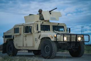 https://www.dvidshub.net/image/5536636/soldier-controls-50-cal-machine-during-perimeter-defense-exercise