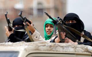 Armed women loyal to the Houthi movement ride on the back of a truck as they take part in a parade to show support for the movement in Sanaa, Yemen September 6, 2016. REUTERS/Khaled Abdullah