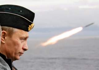 Russian President Putin watches the launch of a missile during naval exercises in Russia's Arctic North on board the nuclear missile cruiser Pyotr Veliky. Russian President Vladimir Putin watches the launch of a missile during naval exercises in Russia's 