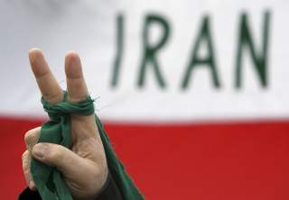 An Iranian citizen living in Hungary attends a demonstration in Budapest organised by Amnesty International to protest against what the protesters say are human rights violations in Iran March 10, 2010. REUTERS/Karoly Arvai