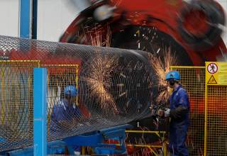 Worker at a welding machine prepare a steel cage for the concrete cover of the pipes for theNord Stream pipeline at a storage facility in Mukran on the Baltic sea island of Ruegen April 8, 2010. Nord Stream will have two pipelines, each with a capacity of