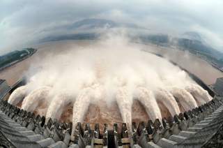 Water is discharged from the Three Gorges Dam to lower the level in its reservoir in Yichang, Hubei province July 20, 2010. Torrential rain that has lashed China for weeks has killed dozens more people in China's west and forced authorities to close shipp