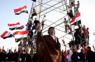 A supporter of Shi'ite cleric Moqtada al-Sadr takes part in a rally, which the participants said was against sectarianism and injustice, in Kut, 150 km (93 miles) southeast of Baghdad, March 16, 2013. REUTERS/Wissm al-Okili (IRAQ - Tags: CIVIL UNREST TPX 