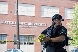 A policeman secures the scene at Seattle Pacific University after the campus was evacuated due to a shooting in Seattle, Washington June 5, 2014. A gunman opened fire on Thursday on the campus of a small Christian college in Seattle, killing one person an