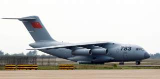 A Y-20 transport plane of People's Liberation Army Air Force is seen on the tarmac after its arrival for the upcoming China International Aviation & Aerospace Exhibition, in Zhuhai, Guangdong province, November 5, 2014. 