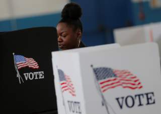 A voter casts her ballot on election day for the U.S. presidential election in Smithfield, North Carolina November 8, 2016. Picture taken November 8, 2016. REUTERS/Chris Keane