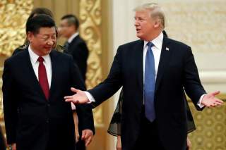 U.S. President Donald Trump and China's President Xi Jinping arrive for a state dinner at the Great Hall of the People in Beijing, China, November 9, 2017. REUTERS/Jonathan Ernst