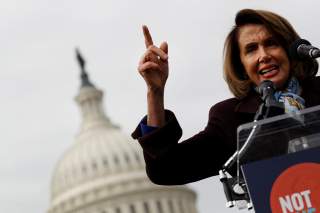 House Minority Leader Nancy Pelosi speaks during a rally against the Republican tax bill on Capitol Hill in Washington, U.S., November 15, 2017. REUTERS/Aaron P. Bernstein