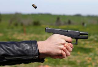 A man shots with a Glock G36 45 caliber during a practice session at a shooting range in Rome, Italy, March 22, 2018. Picture taken March 22, 2018. REUTERS/Max Rossi