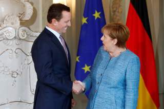 German Chancellor Angela Merkel receives the ambassador of U.S. to Germany, Richard Grenell, in Meseberg, Germany July 6, 2018. REUTERS/Axel Schmidt