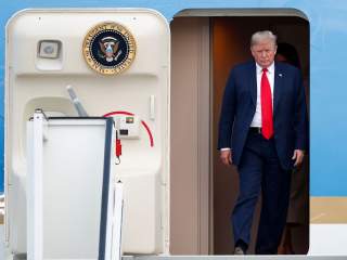 U.S. President Donald Trump and first lady Melania Trump arrive aboard Air Force One ahead of the NATO Summit, at Brussels Military Airport in Melsbroek, Belgium July 10, 2018. REUTERS/Francois Lenoir TPX IMAGES OF THE DAY