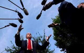 Top White House economic adviser Larry Kudlow speaks to reporters at the White House in Washington, U.S., August 16, 2018. REUTERS/Kevin Lamarque