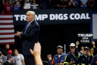 U.S. President Donald Trump acknowledges coal miners during a Make America Great Again rally at the Civic Center in Charleston, West Virginia, U.S., August 21, 2018. REUTERS/Leah Millis