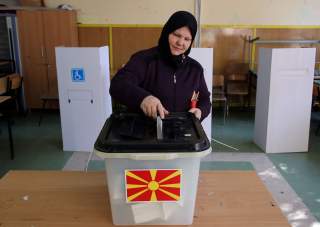 A woman casts her ballot for the referendum in Macedonia on changing the country's name that would open the way for it to join NATO and the European Union in Skopje, Macedonia September 30, 2018. REUTERS/Marko Djurica