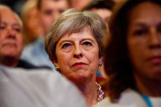 Britain's Prime Minister Theresa May sits in the audience at the start of the Conservative Party Conference in Birmingham, Britain September 30, 2018. REUTERS/Toby Melville