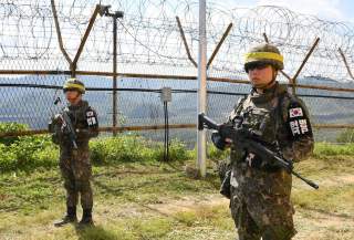 South Korean soldiers stand guard while removing landmines inside of the Demilitarized Zone (DMZ) on October 2, 2018 in Cheorwon, South Korea. Picture taken October 2, 2018. Song Kyung-Seok/Pool via REUTERS