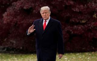 FILE PHOTO: U.S. President Donald Trump walks to board the Marine One helicopter to begin his travel to Mississippi from the White House in Washington, U.S. November 26, 2018. REUTERS/Jonathan Ernst/File Photo