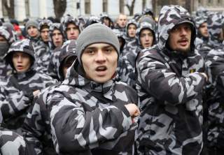 Activists of Ukraine's far-right parties attend a rally demanding to terminate diplomatic relations with Russia, near the Presidential administration headquarters in Kiev, Ukraine December 7, 2018. REUTERS/Gleb Garanich